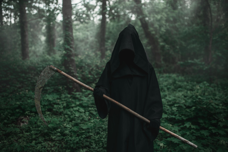 Robed Villain holding a scythe